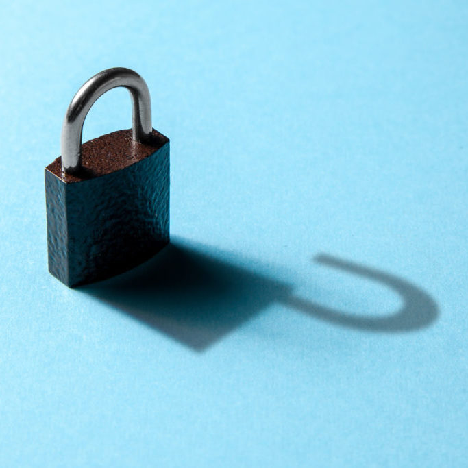The concept of available private information, hacking. Closed lock on blue background with the shadow of an open lock.
